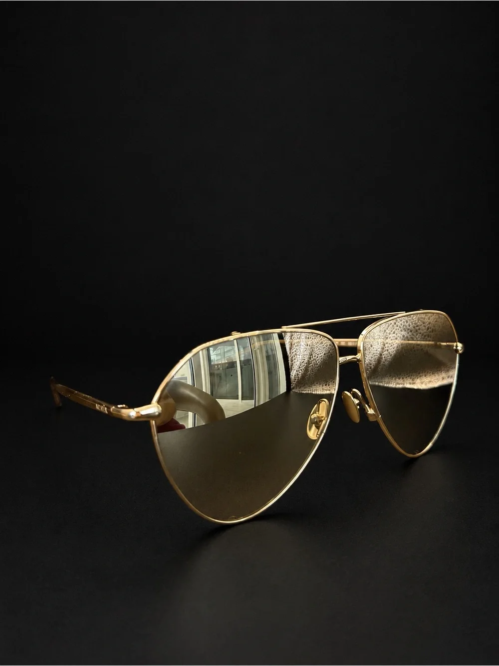Alaïa Gold Frame Sunglasses with White Side Shields